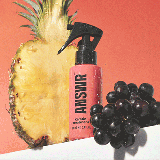 ANSWR keratin treatment bottle with pineapple and grapes